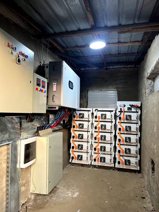 Battery energy storage and control panel installed at a power site