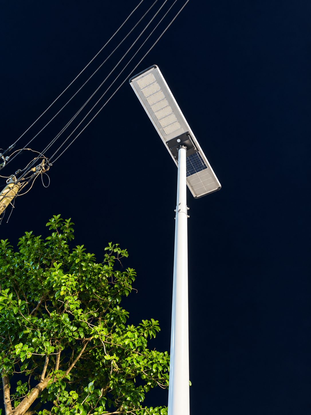 Close view of an all-in-one solar street light head at night